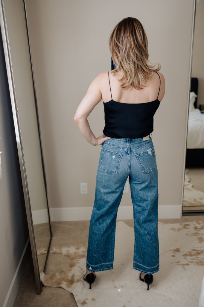 2021 90s jeans outfit styling in high waist AG Knoxx distressed and silk camisole.