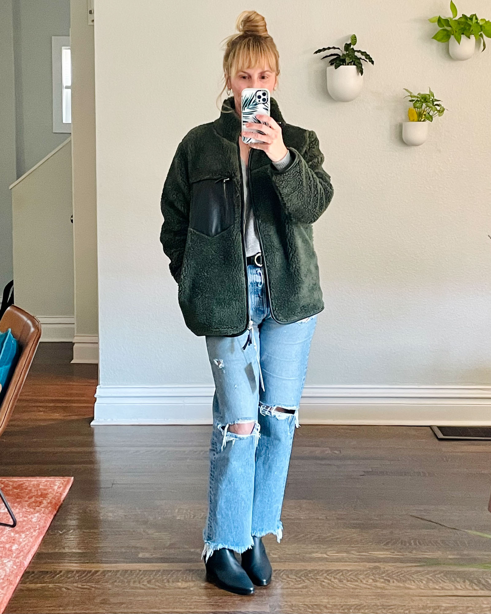 Wearing the Anine Bing Ryder jacket in olive with Moussy jeans and black Frame Lexington booties.