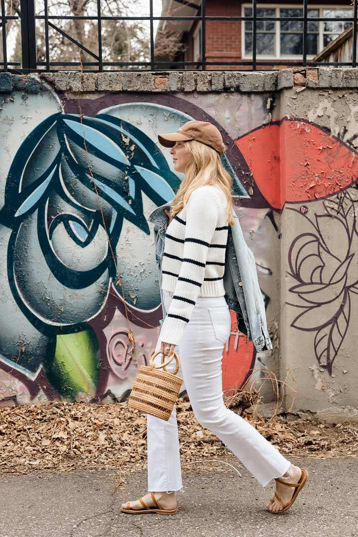 Wearing the Anine Bing Rory denim jacket with white MOTHER Hustler jeans, a Le Ligne striped sweater, and the Cult Gaia Coco Mini tote.