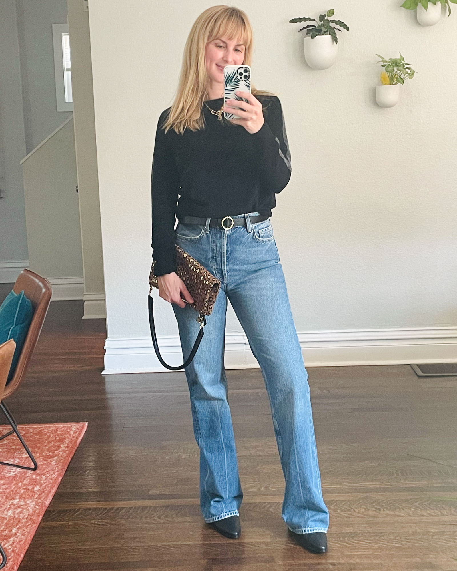 Wearing the Anine Bing bootcut Bryn jeans with a black sweater and Frame boots.