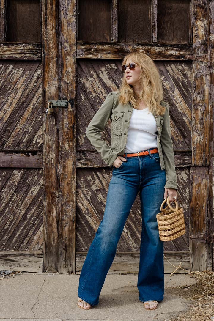 Wearing the Paige Pacey green jacket with MOTHER Hustler Roller jeans, K Jacques sandals, and the Cult Gaia mini Coco tote.