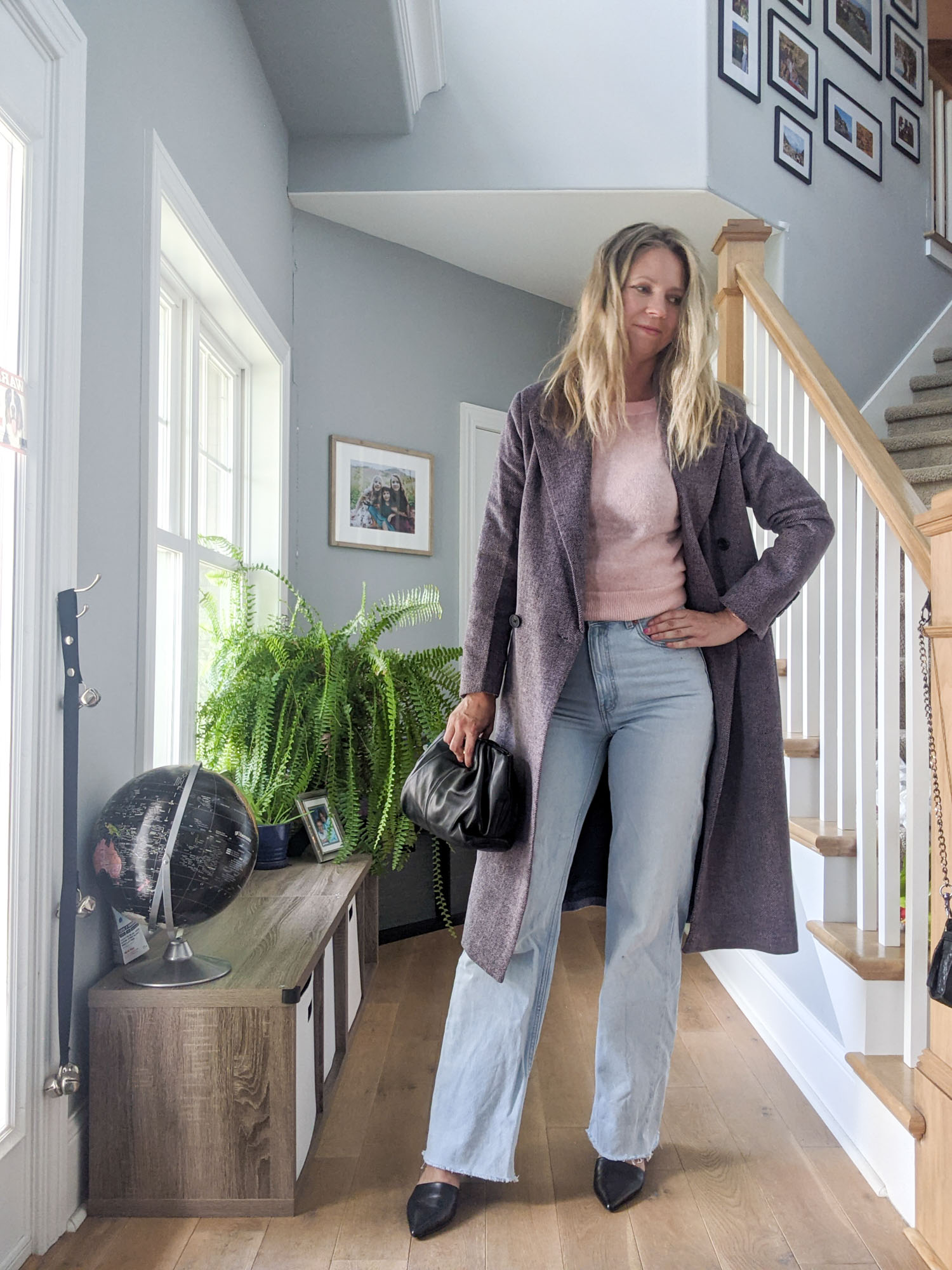 Kristen wearing a pink sweater, light washed jeans and the double breasted Avec Les Filles coat from the Nordstrom Sale.