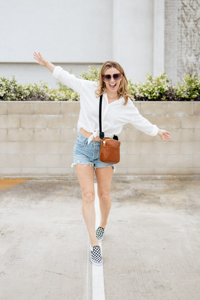 Wearing the Agolde Parker shorts with a Rag & Bone button down tie top plus Vans checkerboard and Clare V. crossbody!