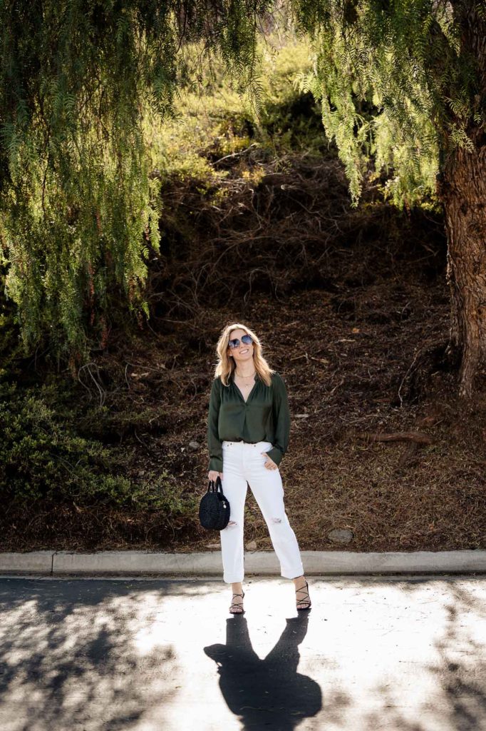Wearing Agolde white 90s jeans with Zadig & Voltaire silk top, Frame top, and Clare V. Bag.