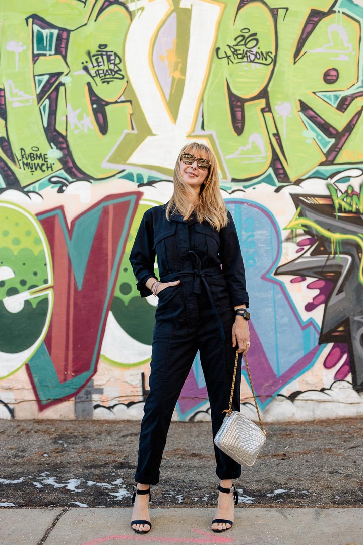 Wearing the Alex Mill Expedition jumpsuit in washed black with Staud pumps and a silver ClareV bag.