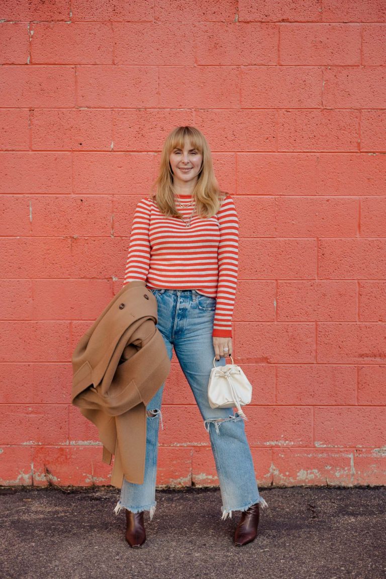 Wearing the Alex Mill Sun Sweater in poppy with Moussy Odessa jeans and a Clare V bag.