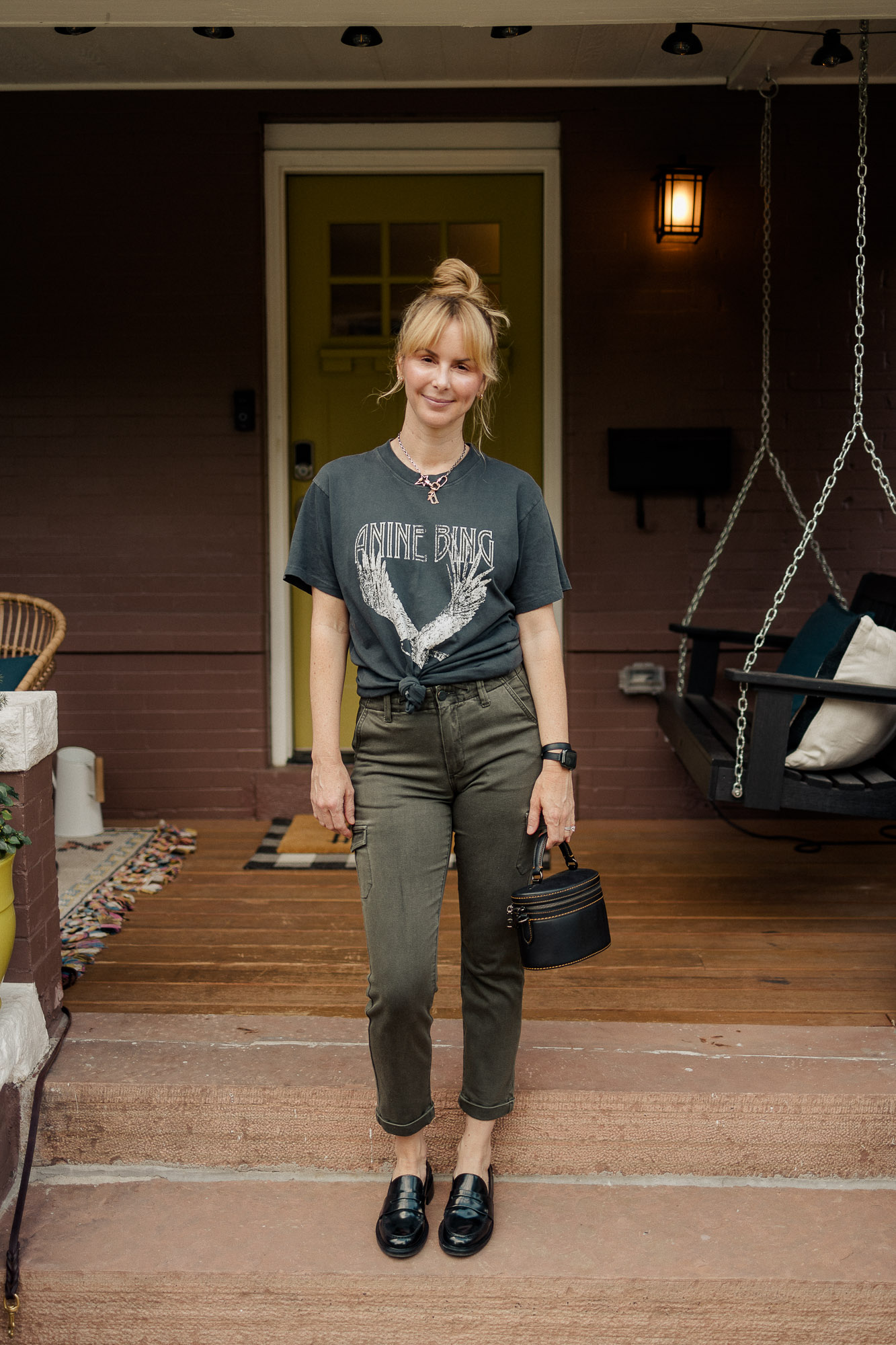 Wearing the Anine Bing Lili tee in washed black with green paige utility pants and black Rag and Bone loafers.