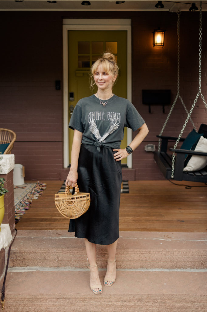 Wearing the Anine Bing Lili tee in washed black over a black silk Vince slipdress.
