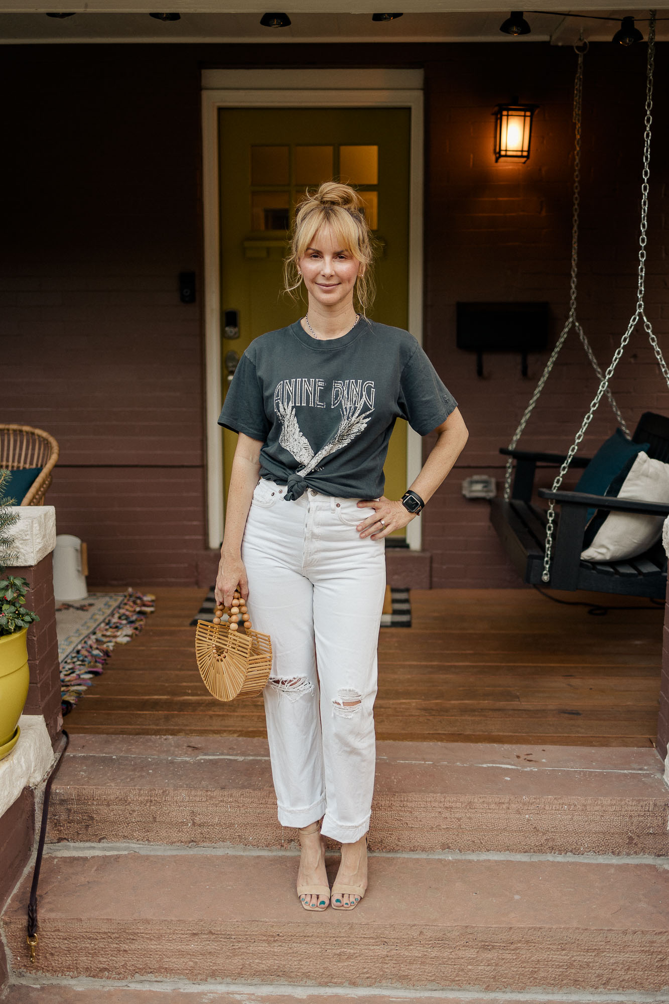 Wearing the Anine Bing Lili tee in washed black with Agolde 90s jeans in white.
