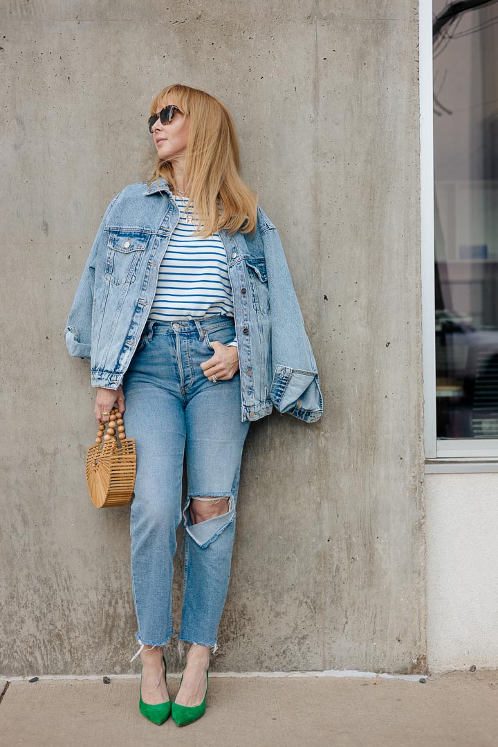 Is double denim in fashion? Wearing the Anine Bing Rory oversized denim jacket with a striped tee by KULE, Redone jeans, and green L'agence Eloise pumps.