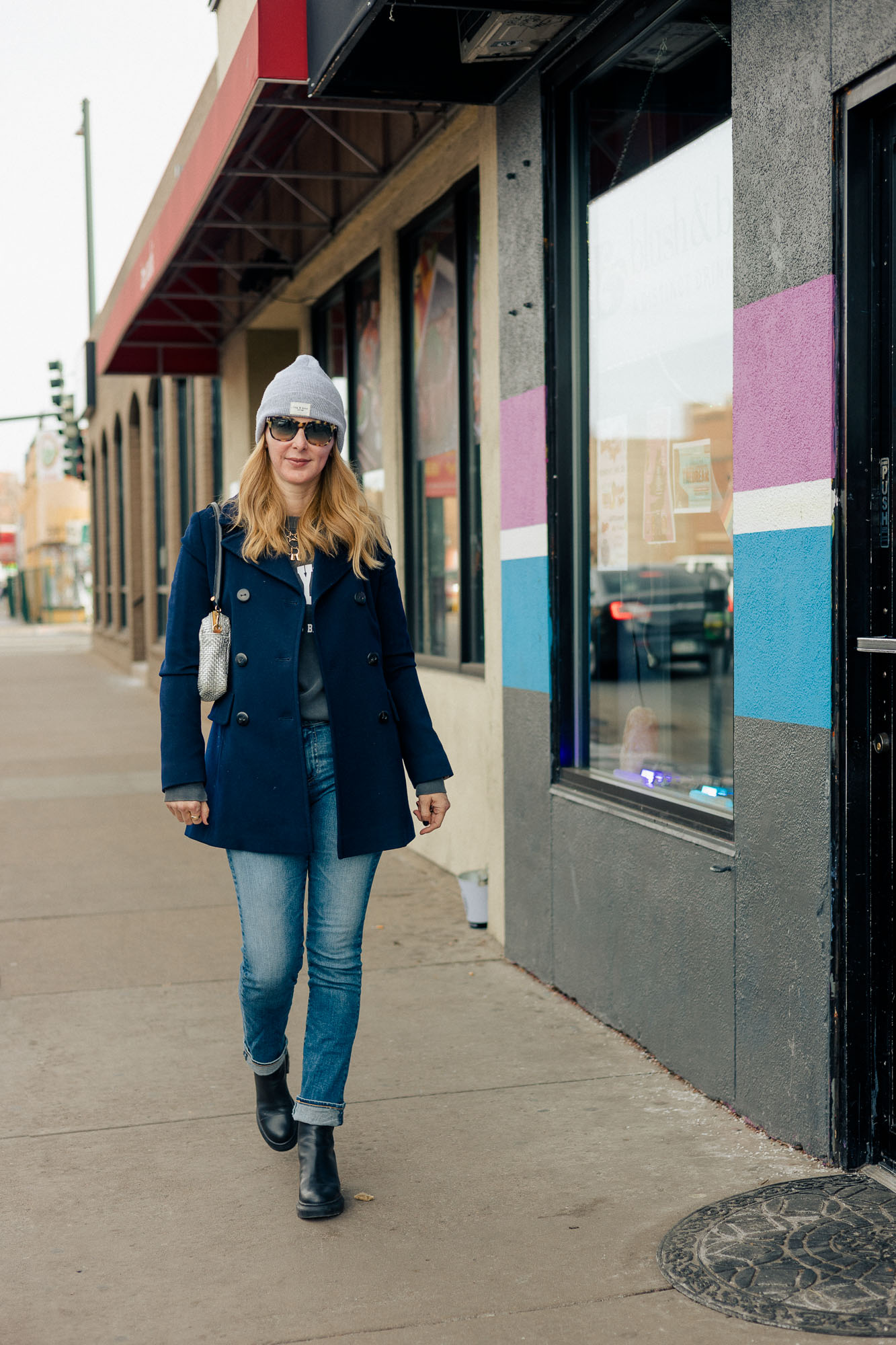 Friday Sale Finds - Wearing a navy Fleurette peacoat with a Rag and Bone beanie, AG jeans and Stuart Weitzman lug boots.
