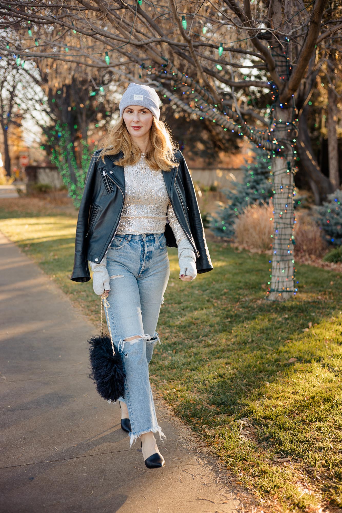 Wearing the free people sequin top in silver with Moussy Odessa jeans and a Iro leather jacket in black.