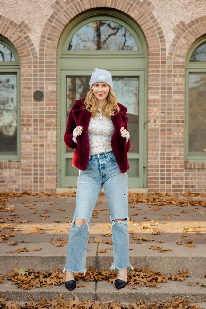 Wearing the Free People Sequin top with Moussy Odessa Jeans and a faux fur coat by Frame. 