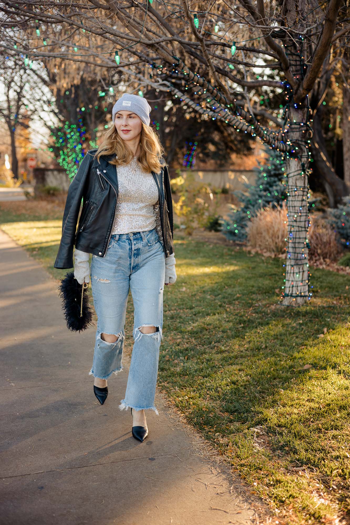 Wearing the Free People Sequin top with Moussy Odessa jeans and an Iro Leather jacket in black.