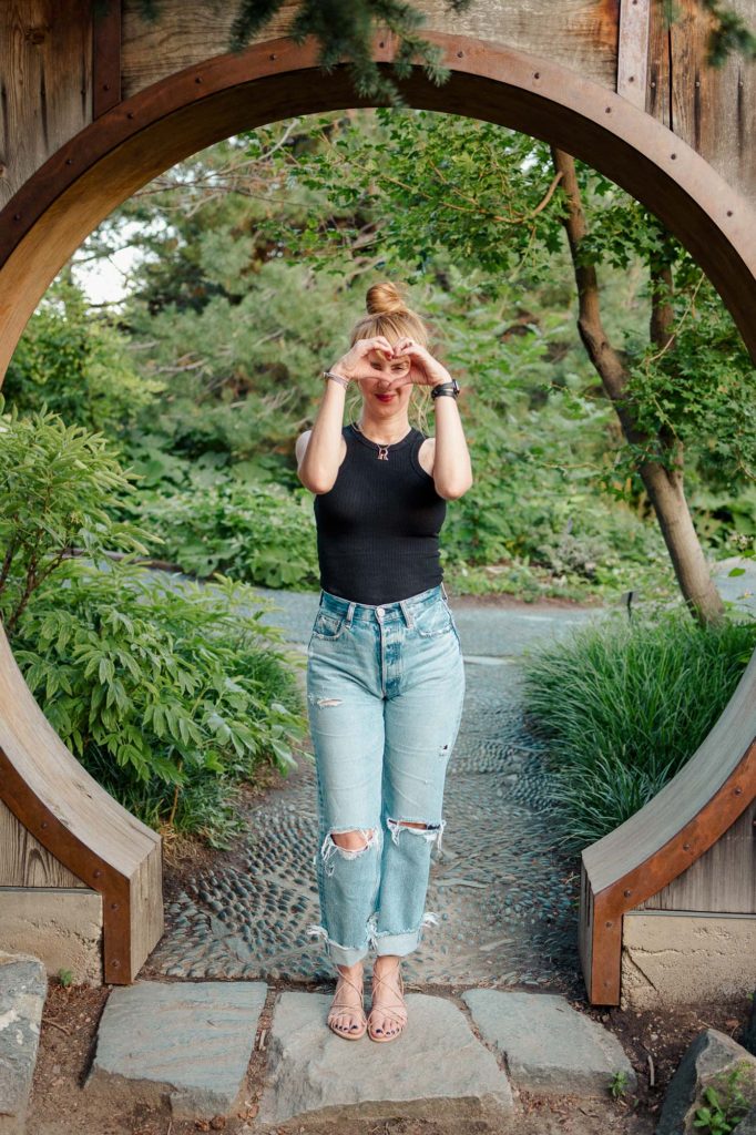 Wearing a black LNA tank, distressed Moussy jeans and nude Sam Edelman nude Tihana sandals at the Denver Botanic Gardens.