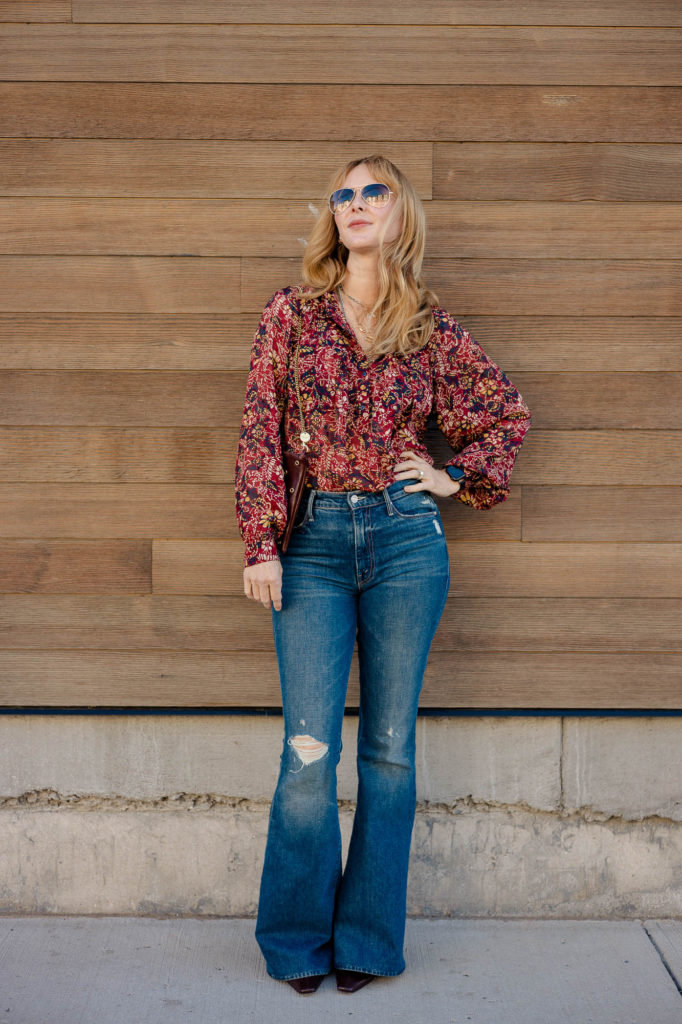 Wearing a Fall blouse by BA&SH with Mother flares.