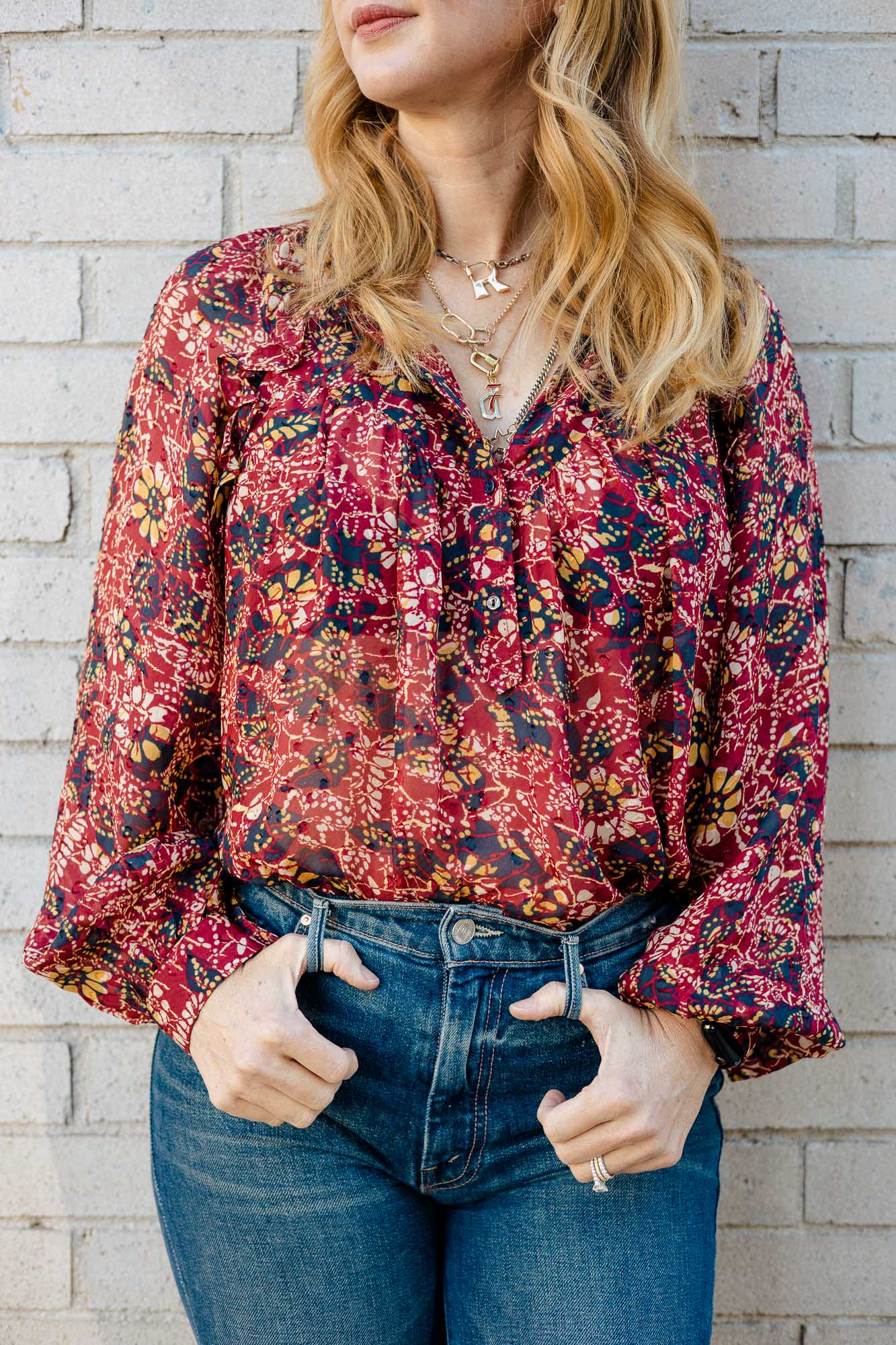 Wearing the ba&sh Gaelle print chiffon blouse in Fall coloors with Mother super cruise jeans.