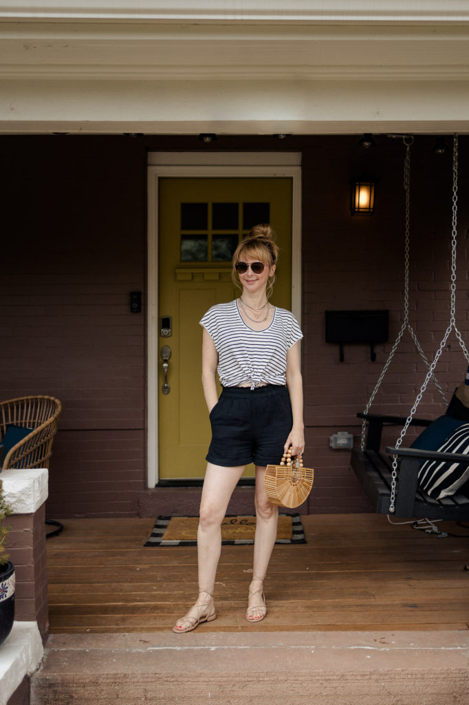 Wearing the black Rails leighton shorts with a black and white striped Frame tee.