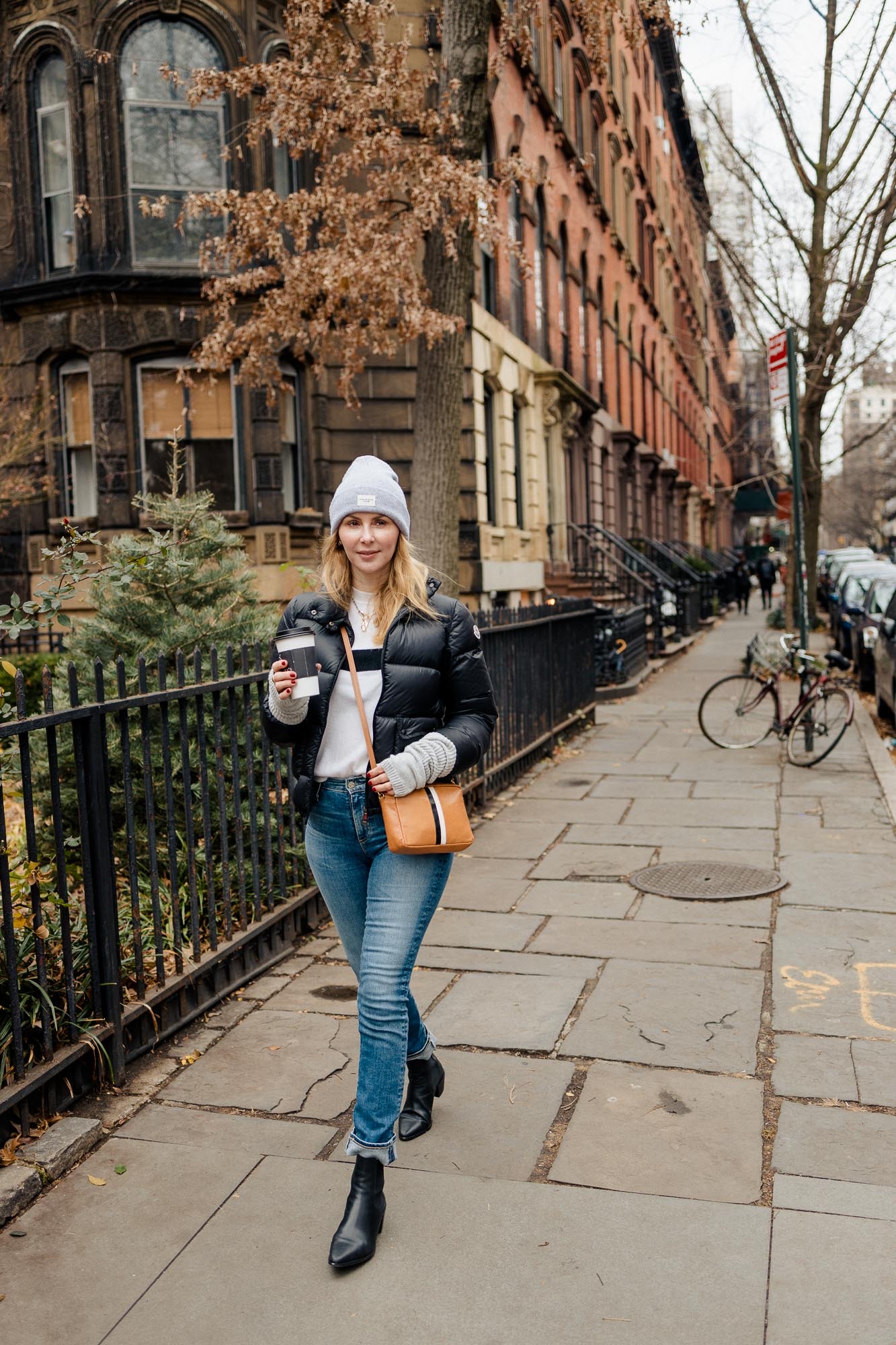 Wearing the AG Mari jeans with a Moncler black puffer and Le Ligne cashmere sweater in NYC.