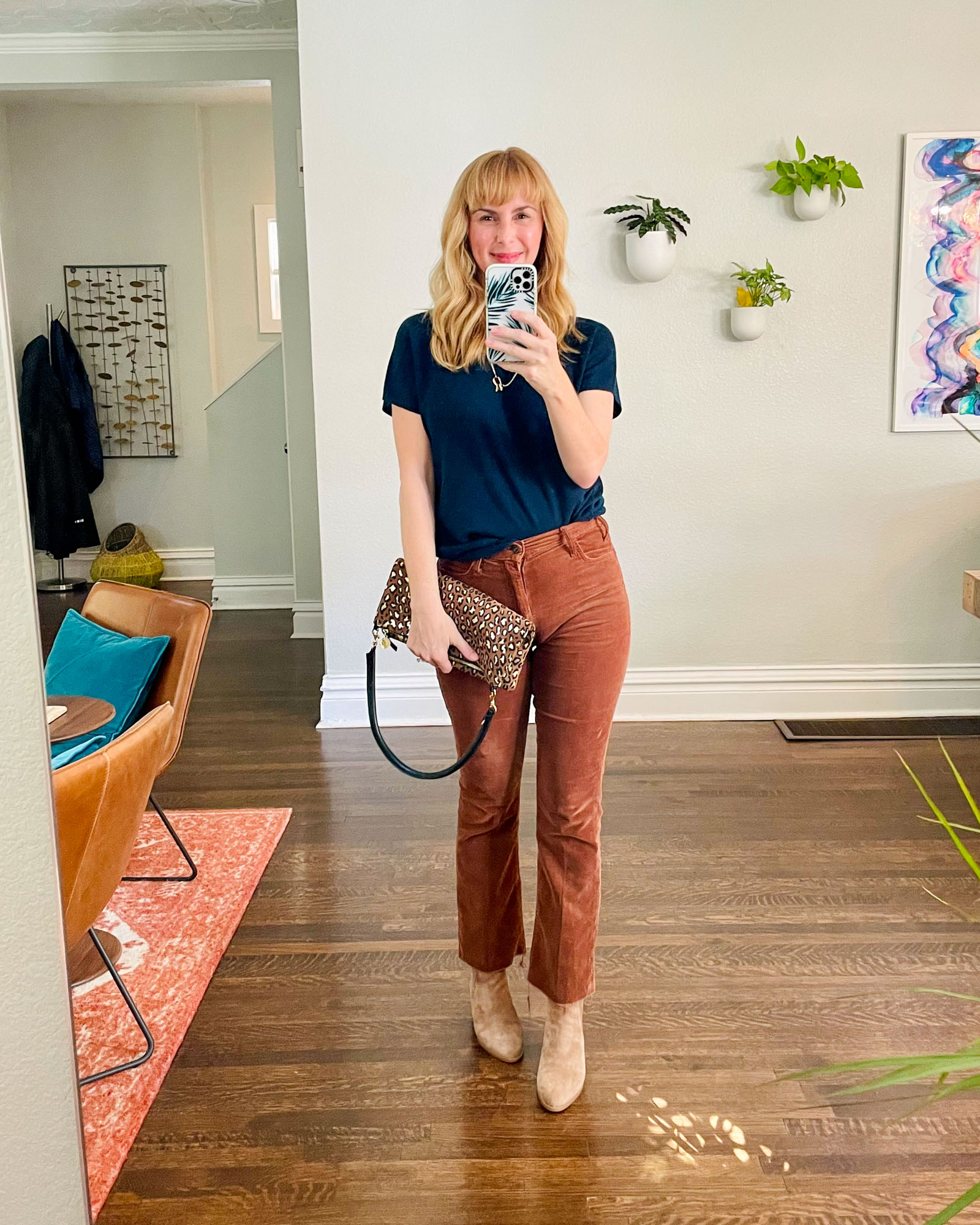 Wearing the Mother Hustler corduroy trousers in brown with a blue short sleeved Vince sweater, camel Rag & Bone booties, and a leopard bag by Clare V.