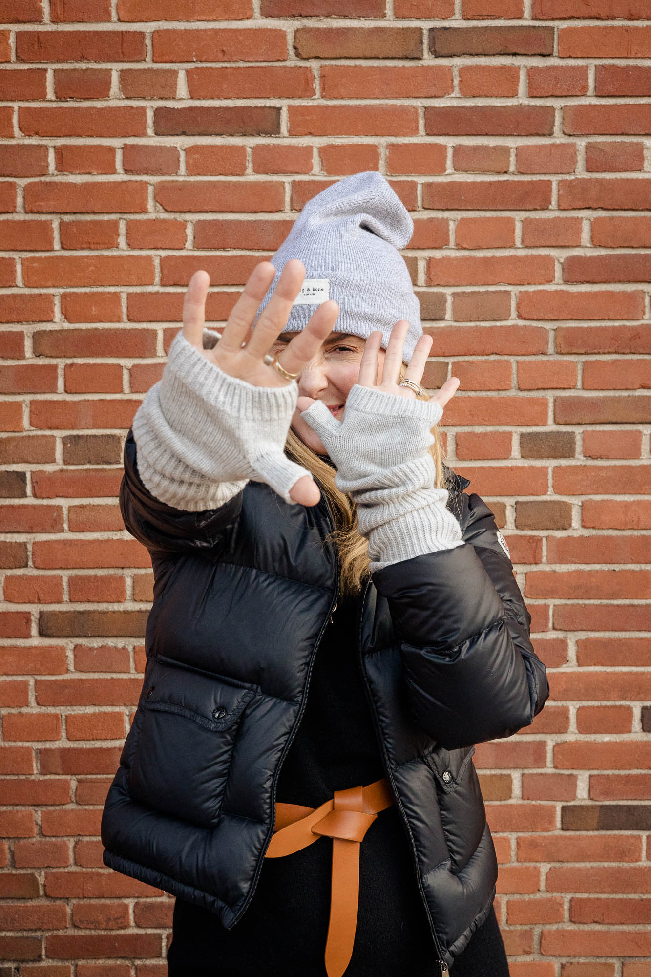 Wearing the Rag and bone Addison beanie in gray with Sweaty Betty gloves.