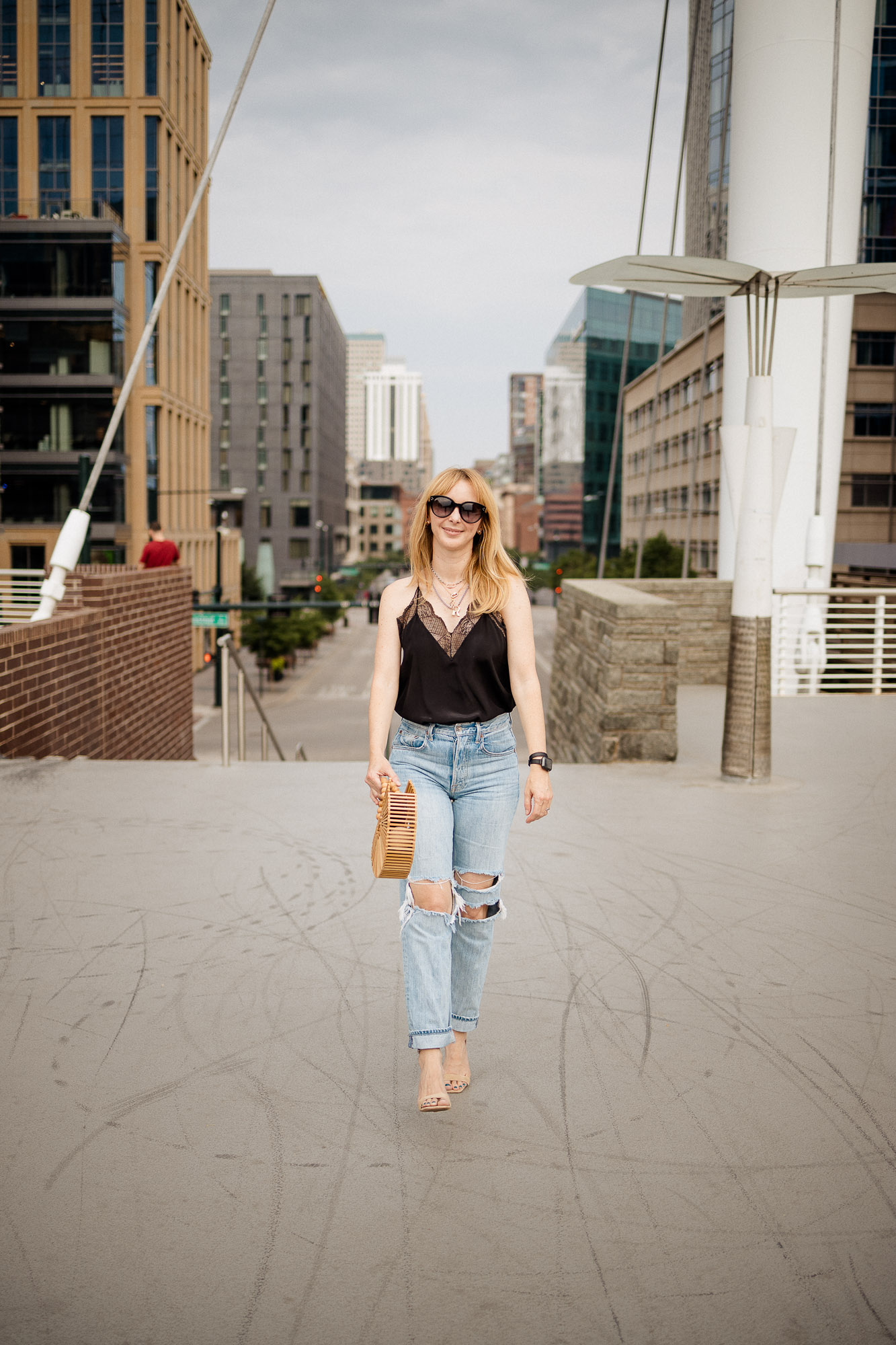 Wearing the black Christy Zadig Voltaire camisole with ripped jeans in downtown Denver.
