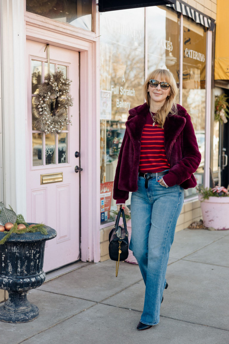Wearing the Mother Kick It straight leg jeans with a a striped La Ligne sweater and faux fur in Burgundy.