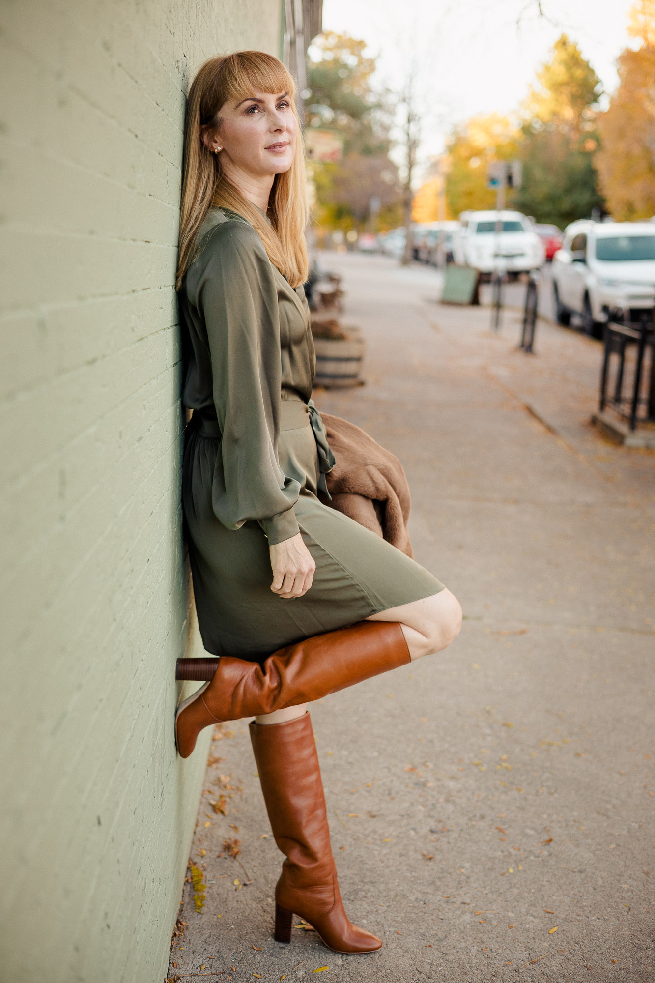 Wearing the Ramy Brook Ayla dress in olive with Loeffler Randall Goldy boots in cognac.