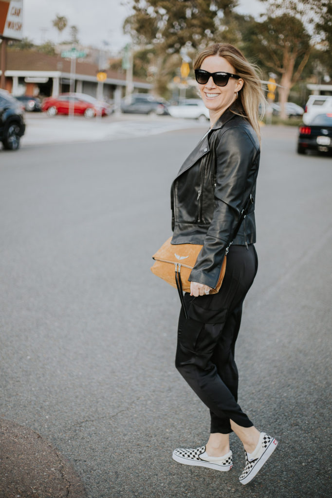 How to style a women's leather jacket with Ramy Brook pants and Zadig Voltaire purse.