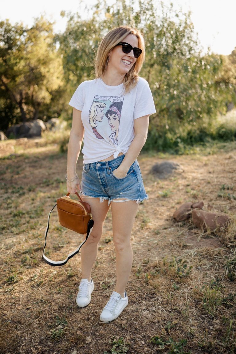 RE/DONE We Can Do It tshirt with Levis shorts and Clare V Mirabel bag at the park.
