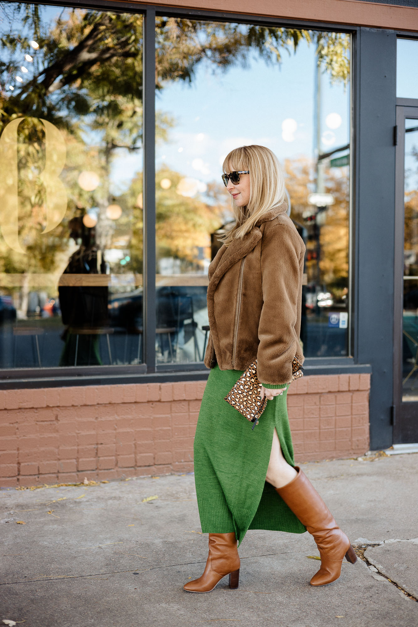 Wearing the Staud crown dress in emerald green with a Vince faux fur coat in brown and Loeffler Randall boots in cognac.