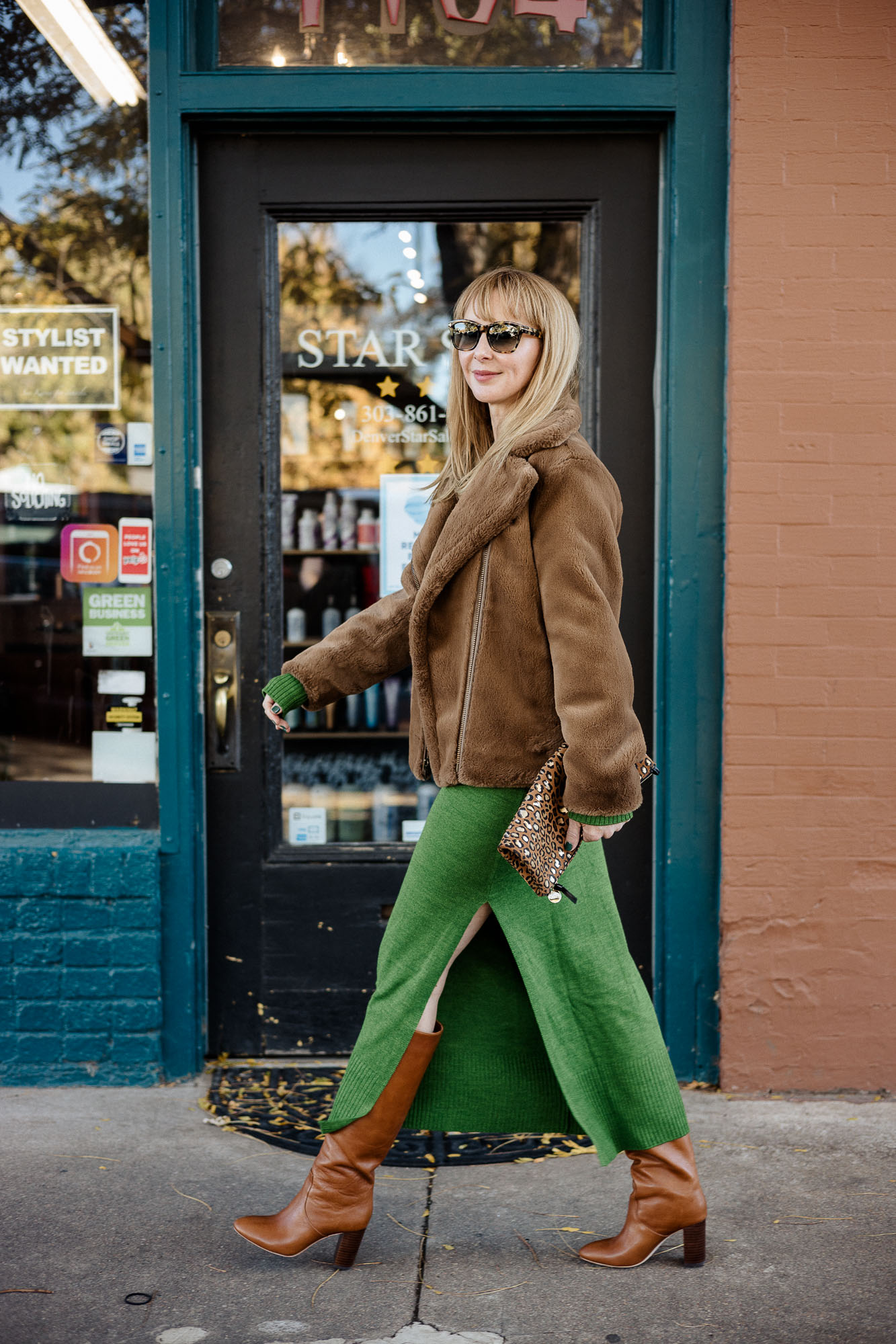 Wearing the Staud crown dress in emerald green with a Vince faux fur coat in brown and Loeffler Randall cognac boots.