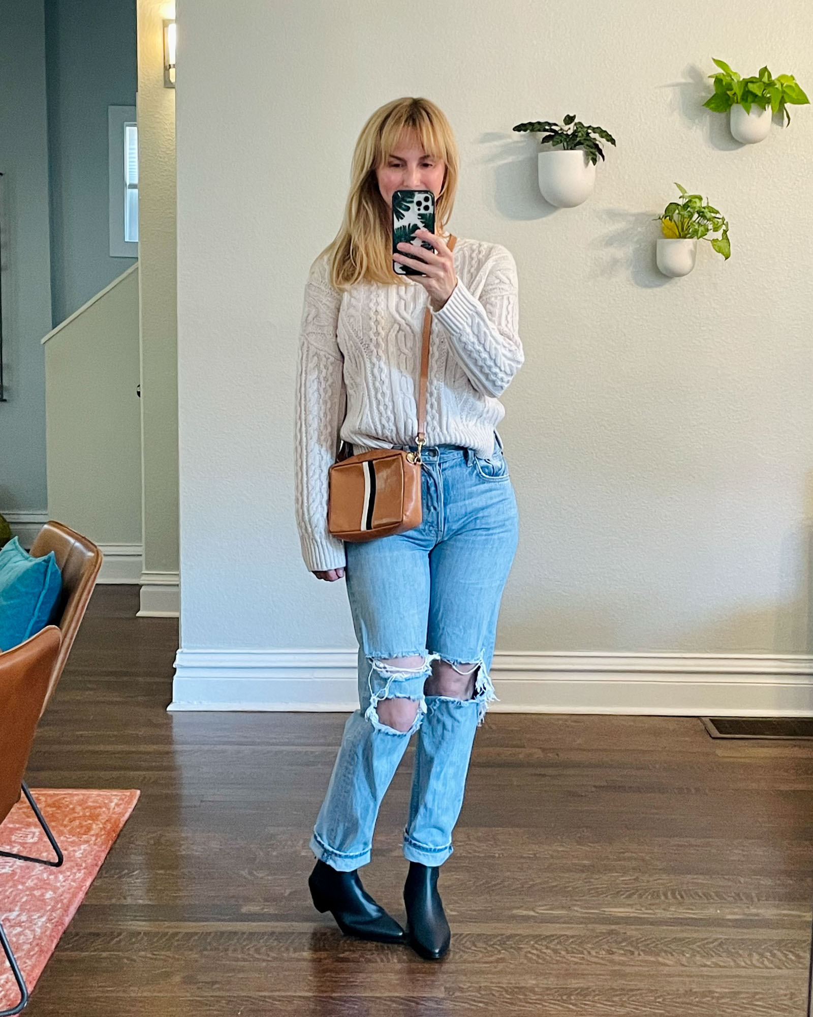 Wearing the vince cable knit sweater with ripped jeans and black Frame chelsea boots from the Nordstrom anniversary sale.
